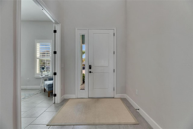 entryway featuring baseboards