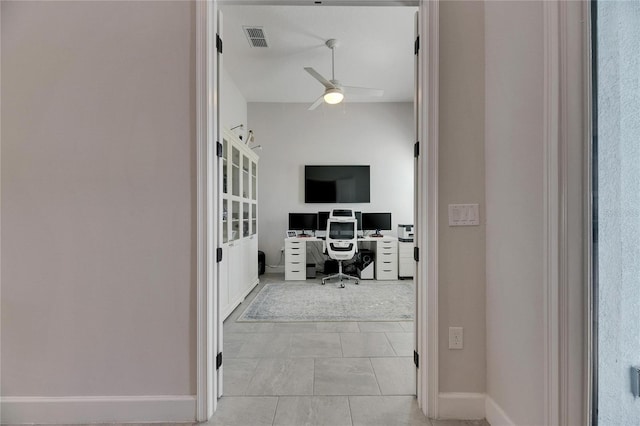 home office featuring ceiling fan, visible vents, and baseboards