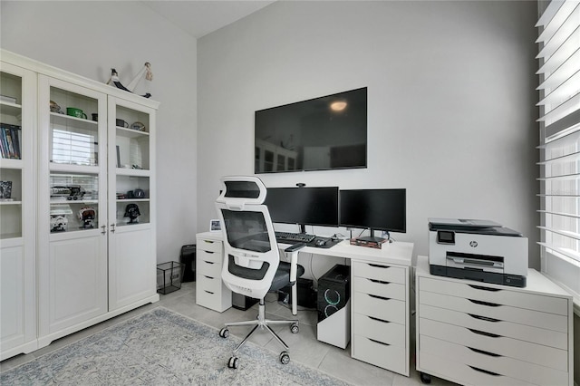 office space with light tile patterned floors and a wealth of natural light