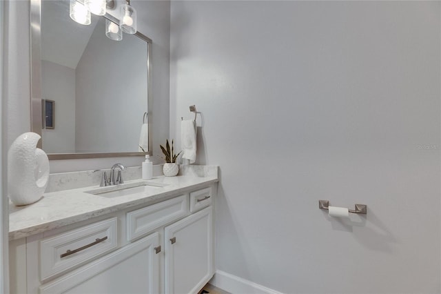 bathroom with vanity and baseboards