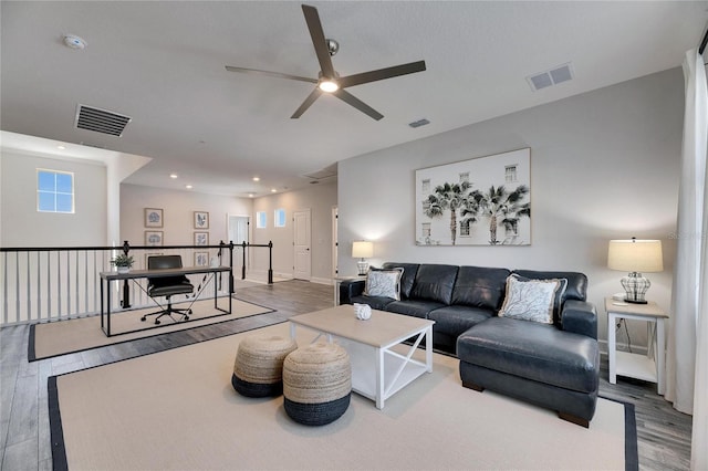 living room featuring wood finished floors and visible vents