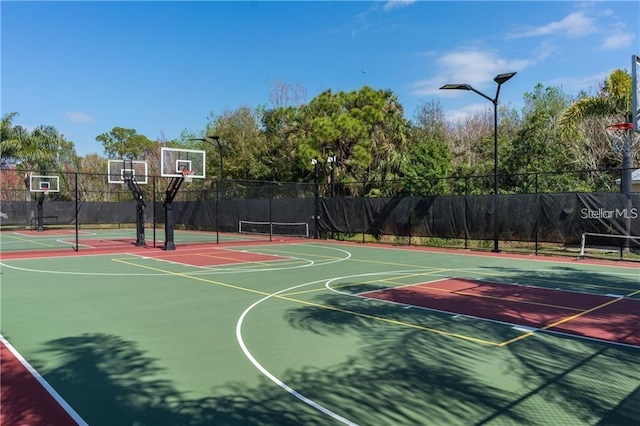 view of sport court with community basketball court and fence