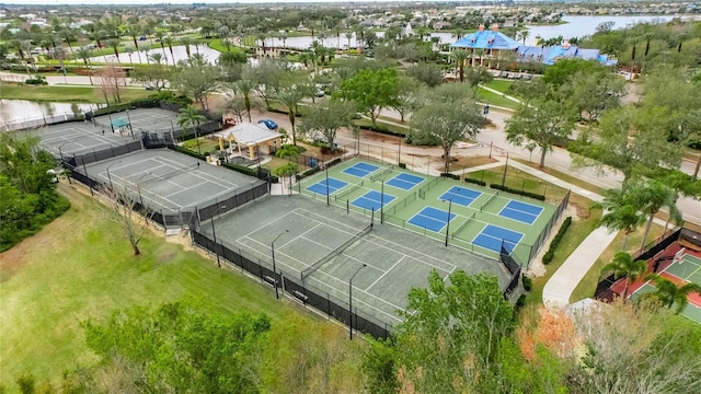 birds eye view of property with a water view