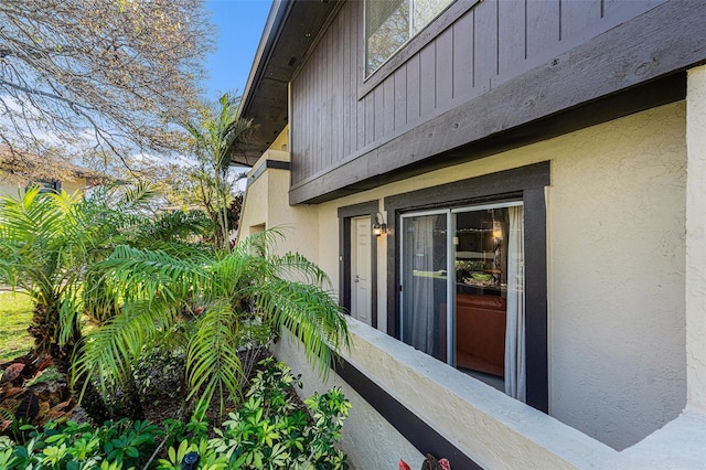 view of side of home with stucco siding