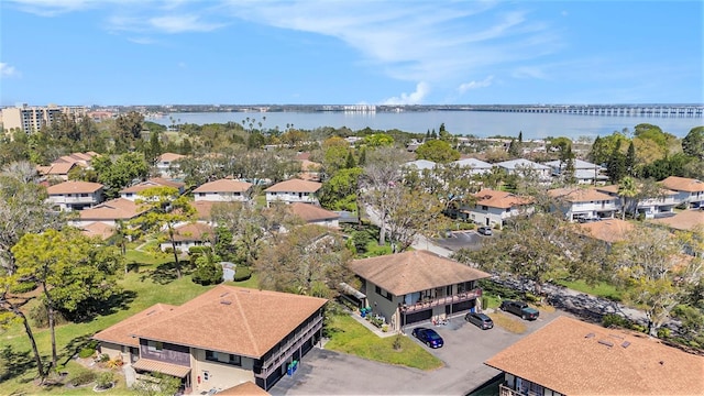 birds eye view of property featuring a water view and a residential view