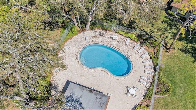 community pool featuring fence