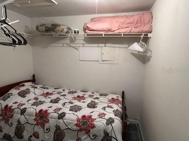 bedroom featuring ceiling fan and baseboards