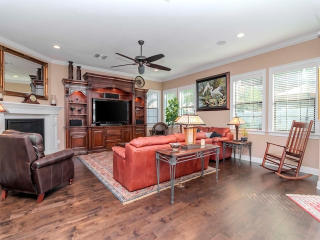 living area featuring ornamental molding, dark wood-style flooring, a fireplace, and baseboards