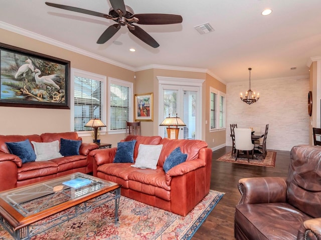living area featuring recessed lighting, a notable chandelier, visible vents, ornamental molding, and dark wood finished floors