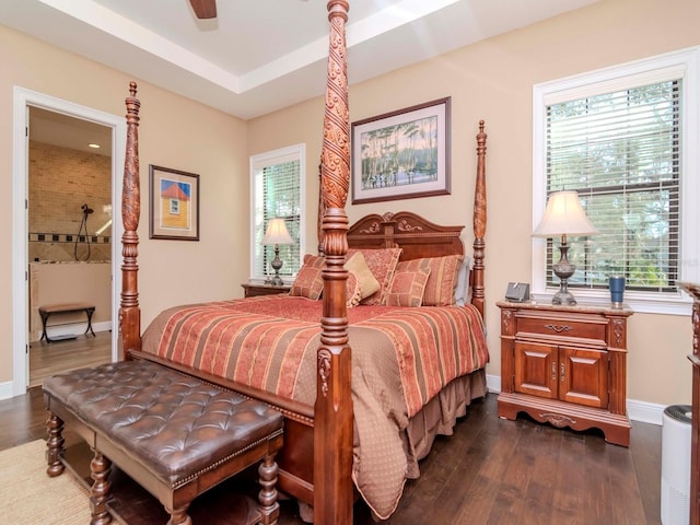 bedroom with ceiling fan, dark wood-style flooring, and baseboards