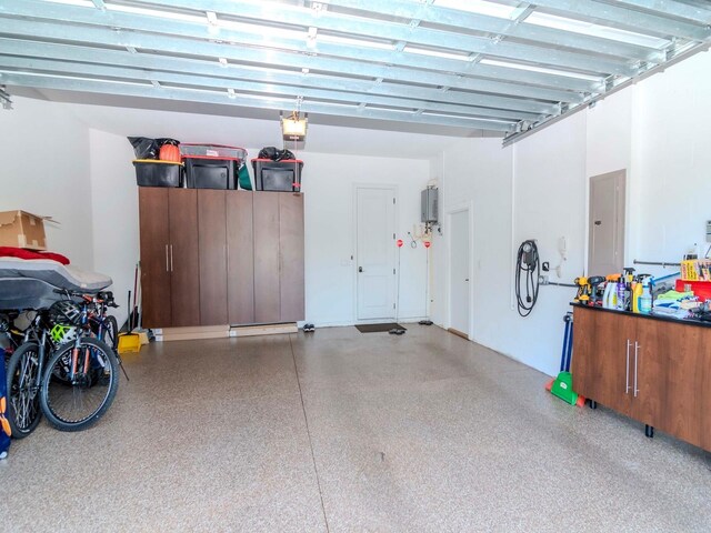 garage featuring a garage door opener and electric panel