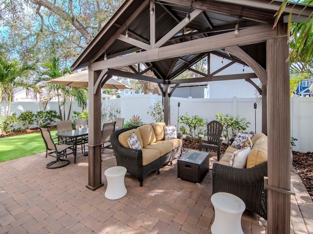 view of patio / terrace with a gazebo, outdoor dining area, outdoor lounge area, and a fenced backyard
