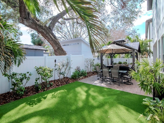 view of yard with a fenced backyard, a patio, and a gazebo