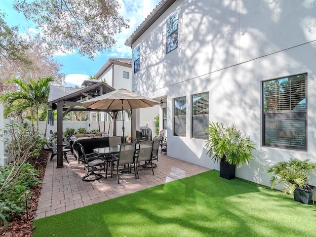 view of patio with a fenced backyard and a gazebo