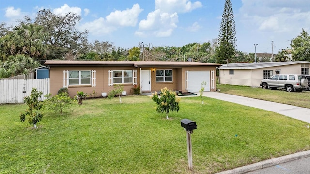 ranch-style house with a garage, a front yard, concrete driveway, and fence