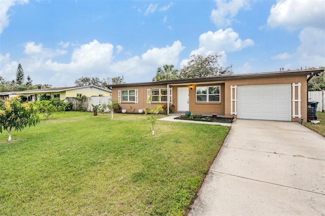 single story home with a garage, driveway, brick siding, and a front yard