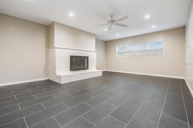 unfurnished living room featuring a ceiling fan, recessed lighting, a fireplace, and baseboards