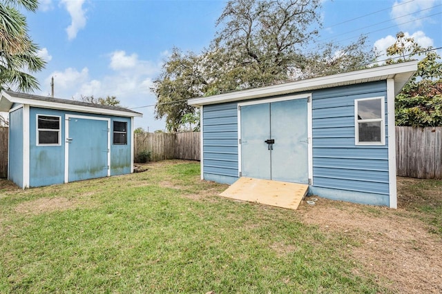 view of shed featuring a fenced backyard