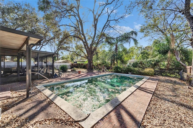 view of pool with a patio, fence, and a fenced in pool