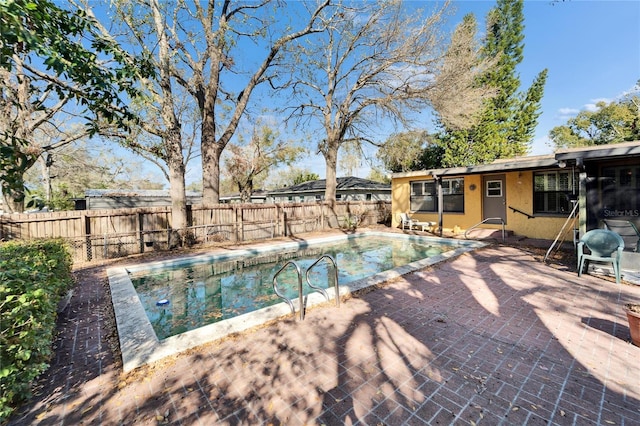 view of pool featuring a fenced in pool, a patio area, and a fenced backyard