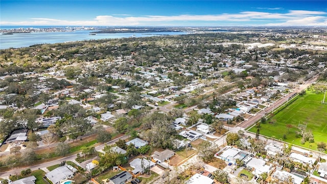 bird's eye view with a residential view and a water view