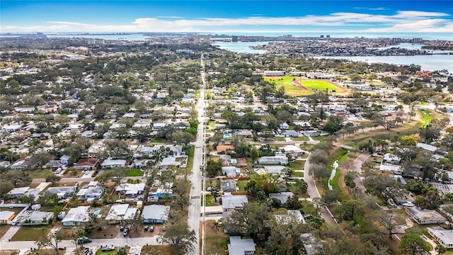 birds eye view of property with a water view and a residential view