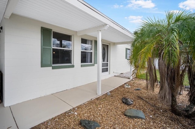 view of property exterior with concrete block siding