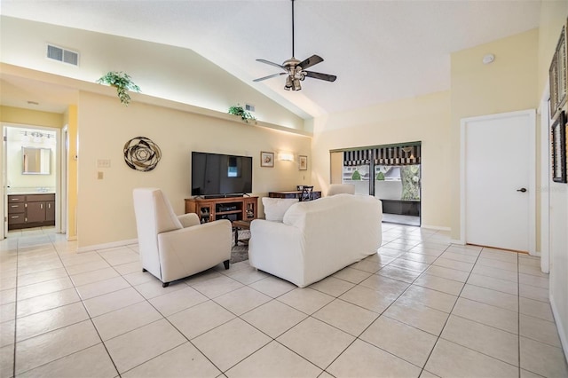 living area featuring light tile patterned floors, visible vents, baseboards, a ceiling fan, and high vaulted ceiling