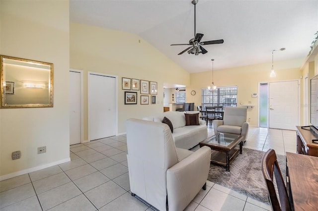 living area featuring light tile patterned floors, baseboards, high vaulted ceiling, and a ceiling fan