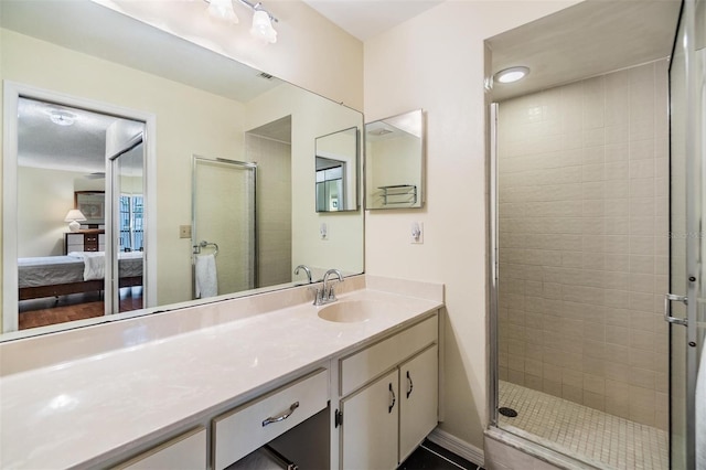 ensuite bathroom with a stall shower, vanity, and ensuite bath