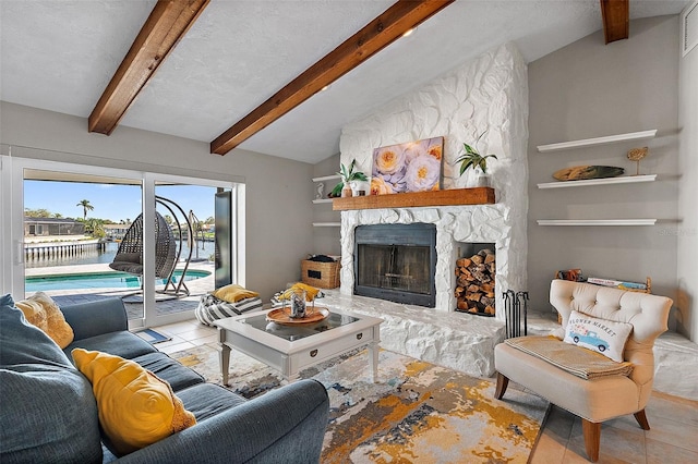 tiled living room featuring vaulted ceiling with beams, visible vents, a textured ceiling, and a stone fireplace