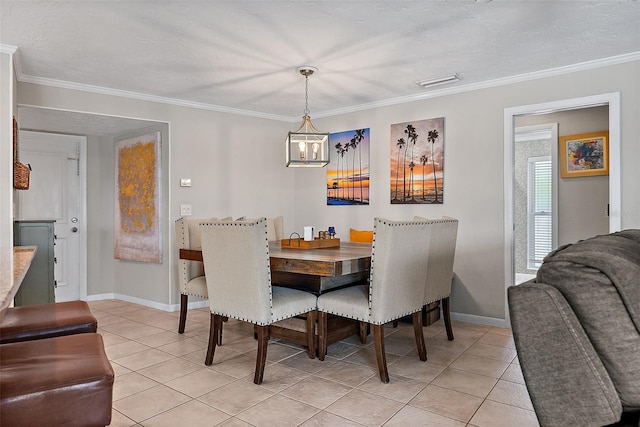 dining area featuring ornamental molding, baseboards, and light tile patterned floors