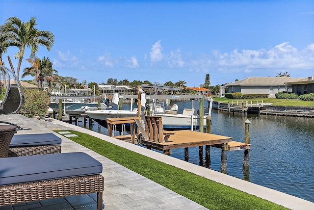 dock area with a water view and boat lift