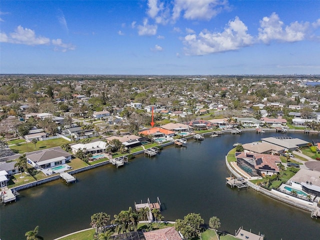 birds eye view of property featuring a water view and a residential view