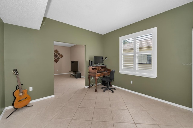 office featuring baseboards and light tile patterned flooring