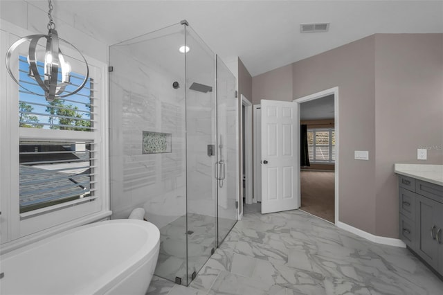 bathroom featuring a stall shower, visible vents, marble finish floor, vanity, and a freestanding tub