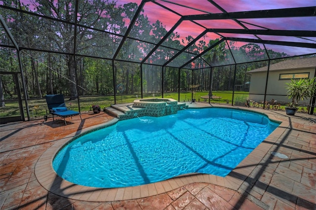 view of swimming pool featuring a pool with connected hot tub, glass enclosure, and a patio