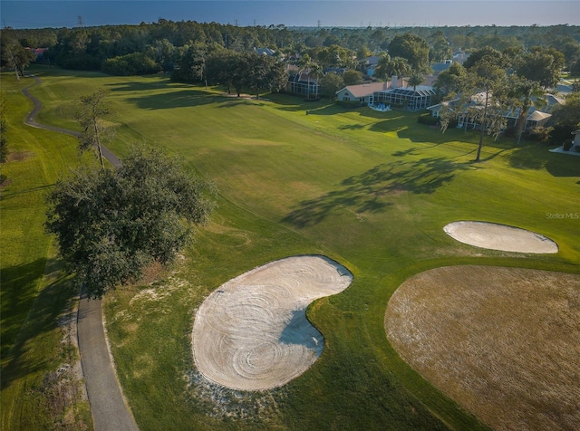 birds eye view of property with view of golf course