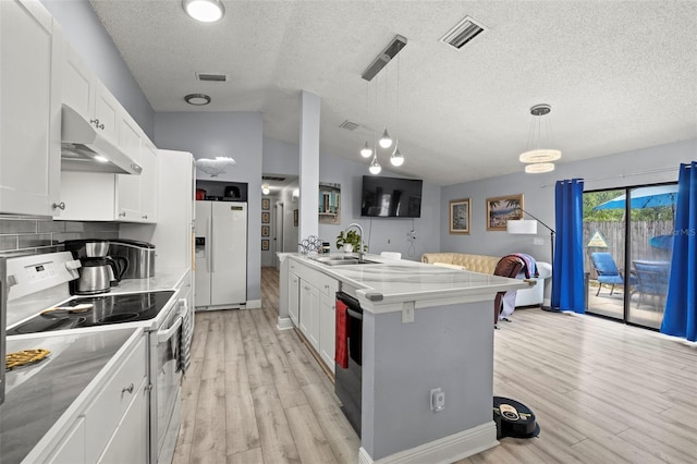 kitchen with light countertops, hanging light fixtures, white cabinetry, white appliances, and under cabinet range hood