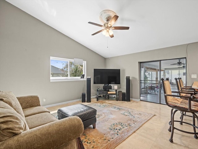 living room with vaulted ceiling, ceiling fan, and baseboards