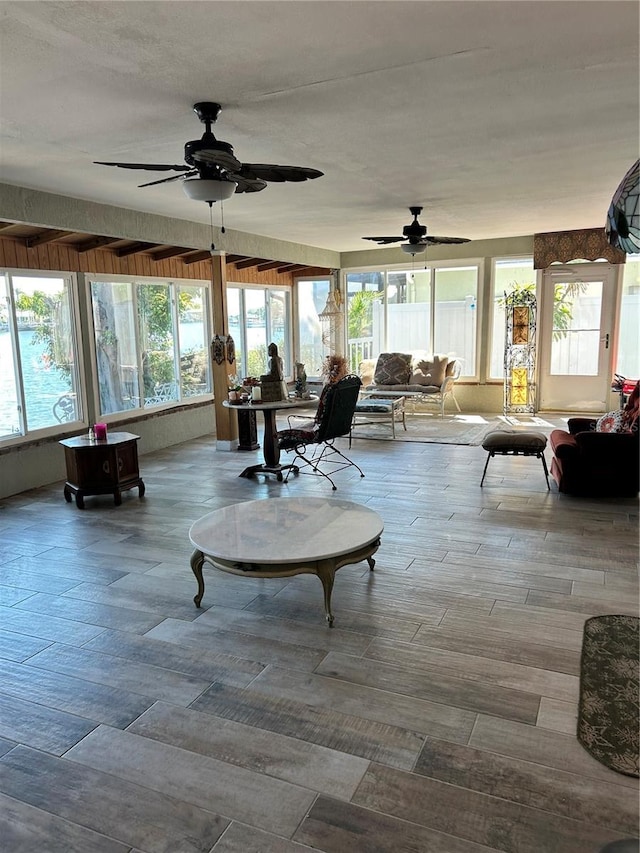 sunroom / solarium featuring plenty of natural light