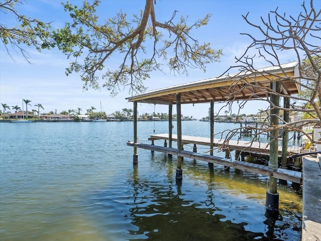 dock area featuring a water view and boat lift