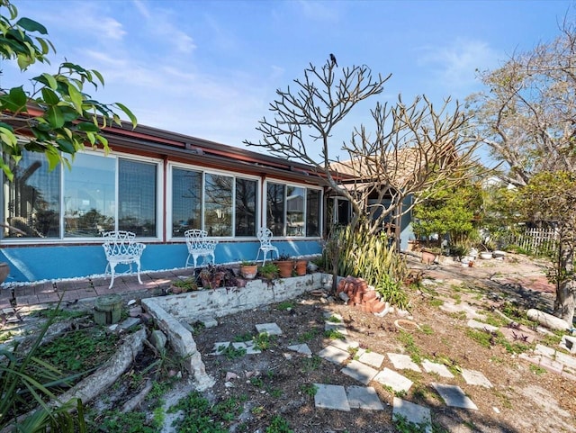 back of house with a sunroom