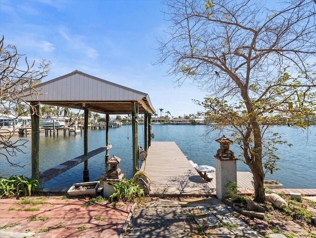 view of dock featuring a water view and boat lift