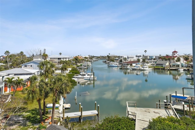 view of dock featuring a water view and a residential view