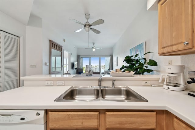 kitchen with a sink, a ceiling fan, open floor plan, light countertops, and dishwasher