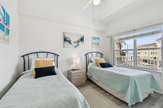 bedroom featuring light wood-style flooring and a ceiling fan