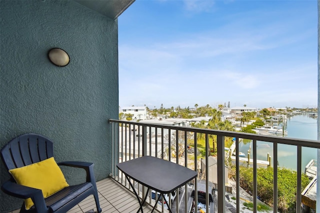 balcony featuring a water view