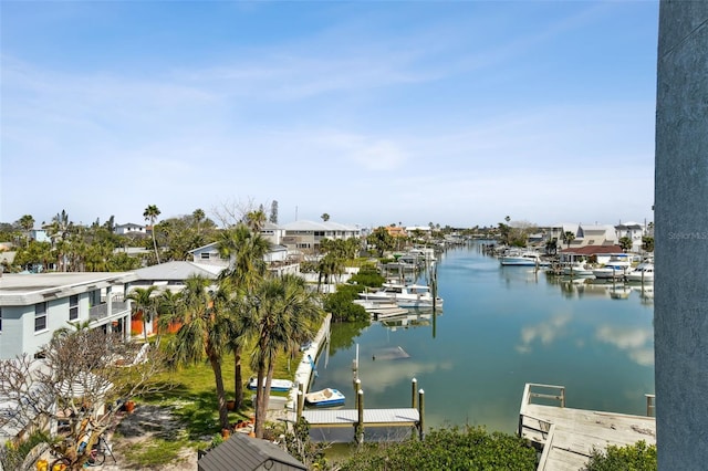 water view with a dock and a residential view