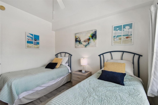 bedroom featuring wood finished floors and a ceiling fan